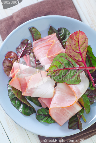 Image of smoked bacon with mangold on plate