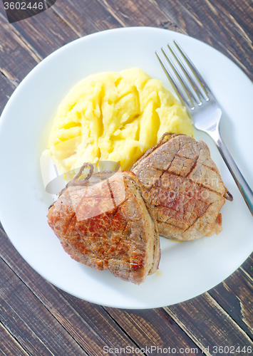 Image of mashed potato and fried meat