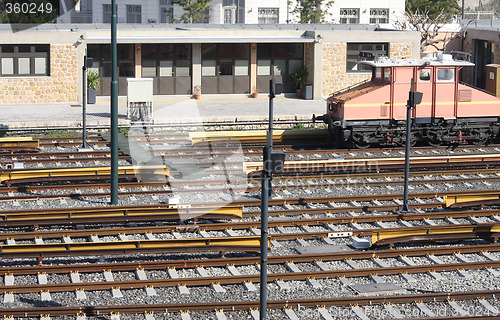 Image of Railway tracks and depot with train