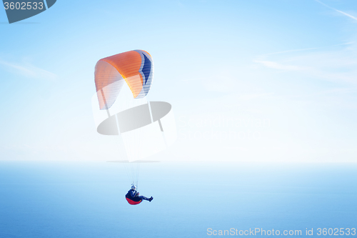 Image of paraglider in sky