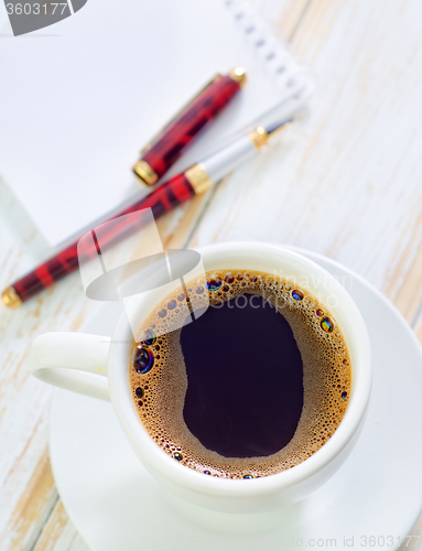 Image of coffee and note
