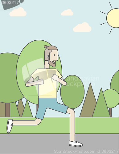 Image of Caucasian hipster man jogging in the park