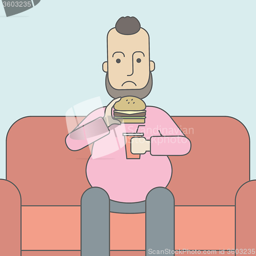 Image of Man eating hamburger. 