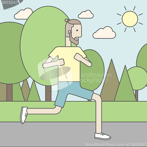 Image of Caucasian hipster man jogging in the park