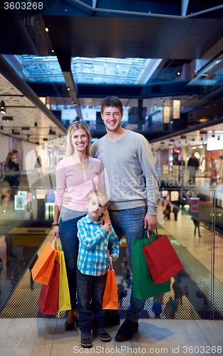 Image of young family with shopping bags