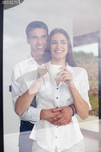 Image of relaxet young couple drink first morning coffee