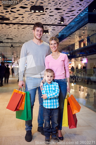 Image of young family with shopping bags