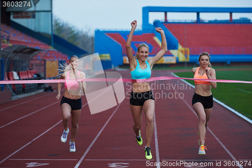 Image of Female Runners Finishing Race Together