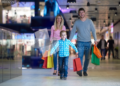Image of young family with shopping bags