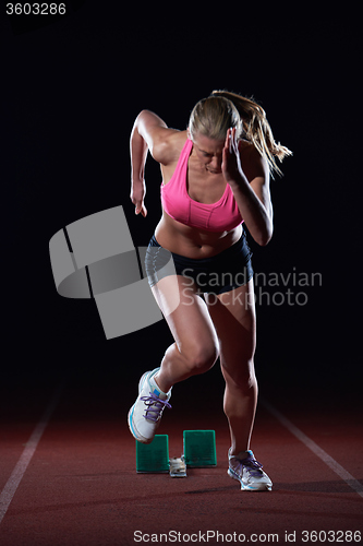 Image of pixelated design of woman  sprinter leaving starting blocks