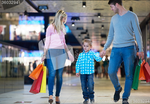 Image of young family with shopping bags