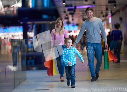Image of young family with shopping bags