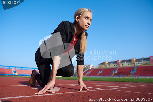 Image of business woman ready to sprint