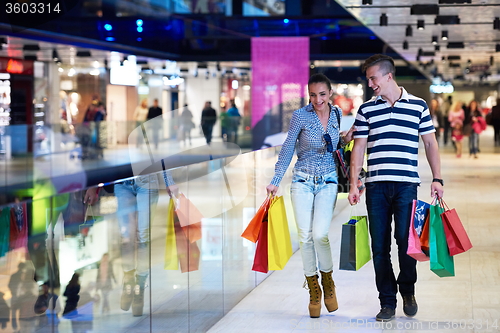 Image of young couple with shipping bags