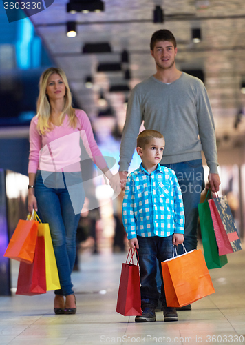 Image of young family with shopping bags