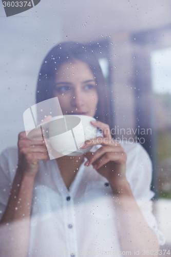 Image of beautiful young woman drink first morning coffee