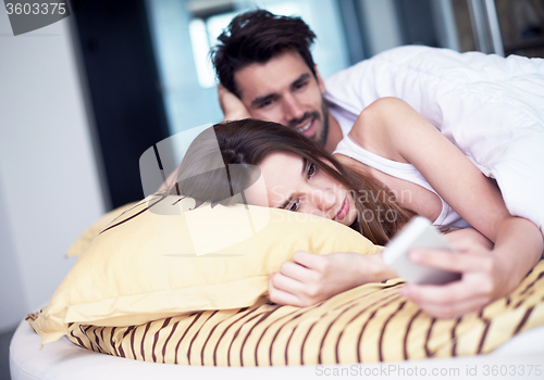 Image of couple relax and have fun in bed