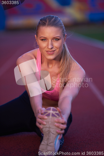 Image of sporty woman on athletic race track