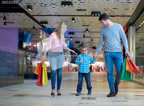 Image of young family with shopping bags