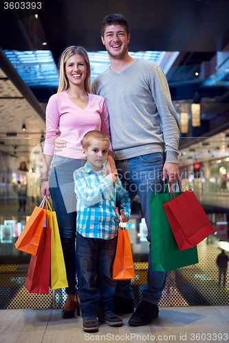 Image of young family with shopping bags