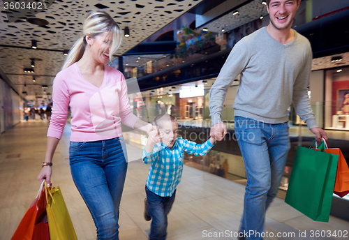 Image of young family with shopping bags