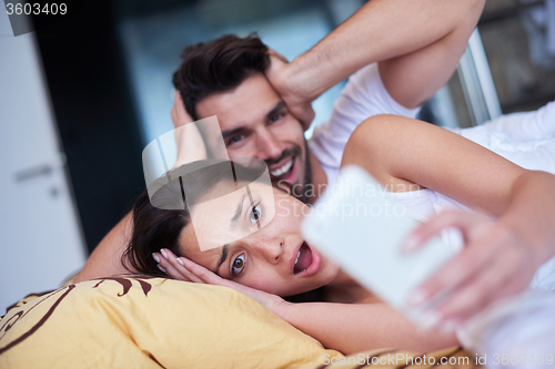 Image of couple relax and have fun in bed