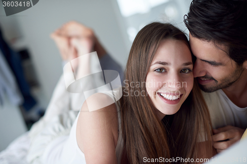 Image of couple relax and have fun in bed