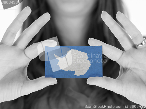 Image of Woman showing a blank business card