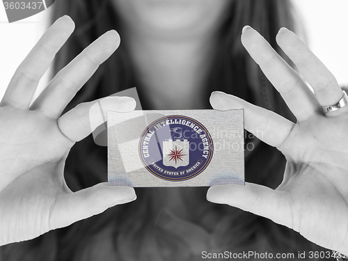 Image of Woman showing a blank business card