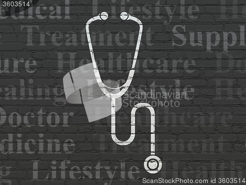 Image of Medicine concept: Stethoscope on wall background