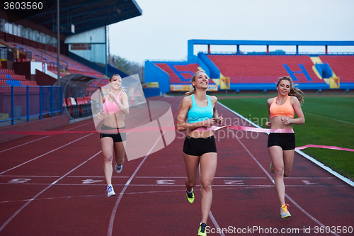 Image of Female Runners Finishing Race Together