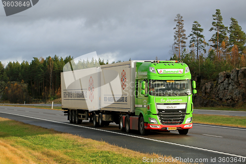 Image of Lime Green DAF XF Full Trailer Truck on Motorway