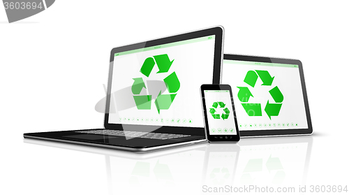 Image of Electronic devices with a recycling symbol on screen. environmen