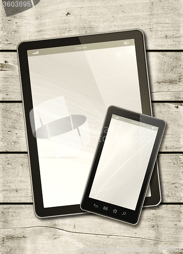 Image of Smartphone and digital tablet PC on a white wood table
