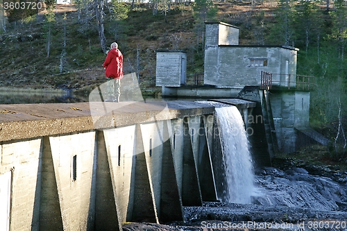 Image of Man fishing on a dam