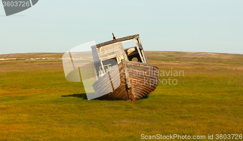 Image of old whaleboat found last marina in tundra