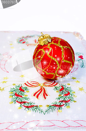 Image of Red Christmas ball embroidered napkin isolated. Christmas decora