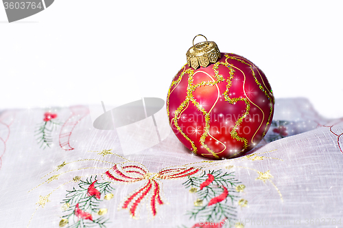 Image of Red Christmas ball embroidered napkin isolated. Christmas decora