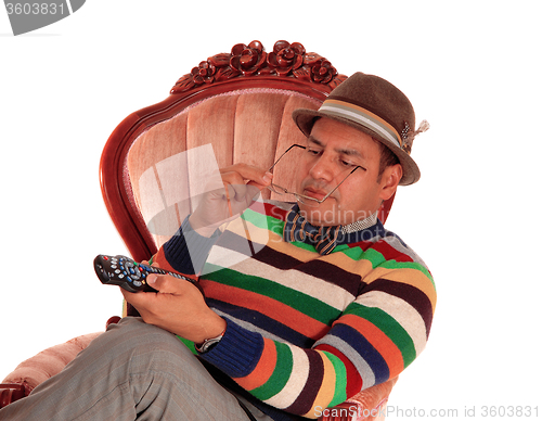 Image of Closeup of man playing with remote control.