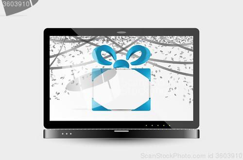Image of gift with ribbons and confetti on laptop screen