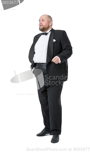 Image of Jolly Fat Man in Tuxedo and Bow tie Shows Emotions