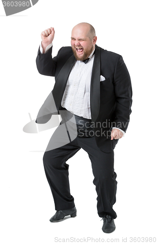 Image of Jolly Fat Man in Tuxedo and Bow tie Shows Emotions