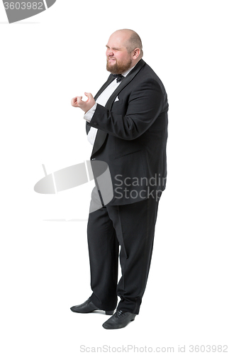 Image of Jolly Fat Man in Tuxedo and Bow tie Shows Emotions