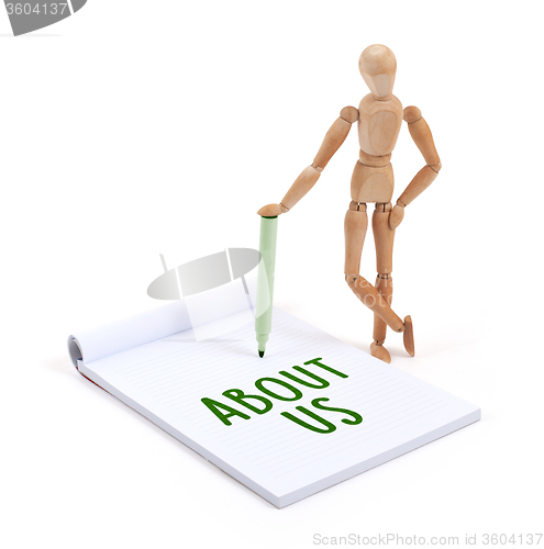 Image of Wooden mannequin writing - About us