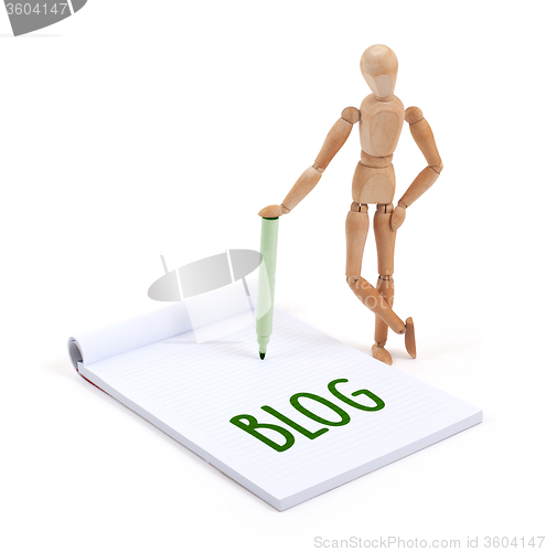 Image of Wooden mannequin writing - Blog