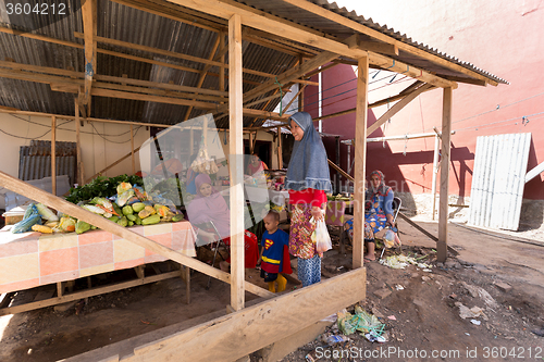 Image of Indonesian muslem woman in street market, Manado