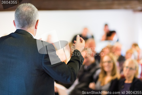 Image of Speaker at Business Conference and Presentation.