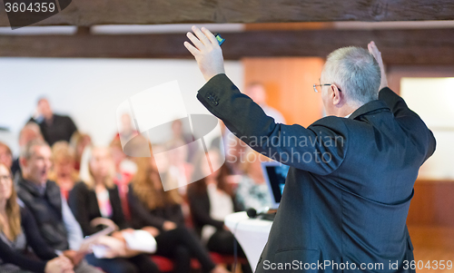 Image of Speaker at Business Conference and Presentation.