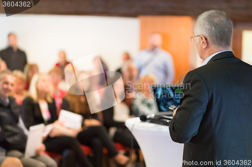 Image of Speaker at Business Conference and Presentation.