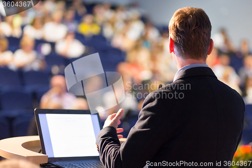 Image of Speaker at Business Conference and Presentation.